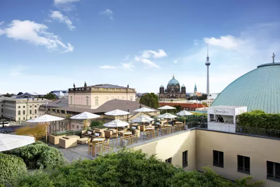 Roof terrace of the Hotel de Rome Berlin with view at Berlin TV Tower